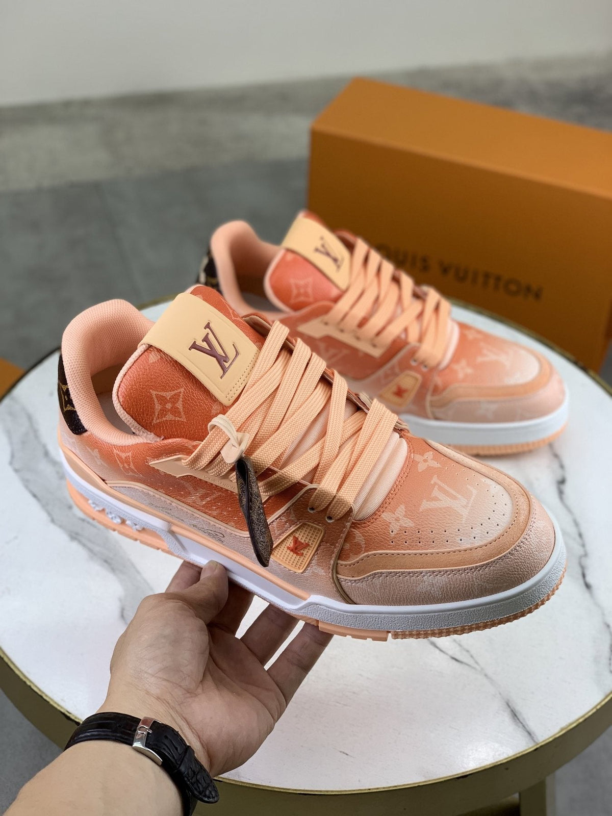 Louis Vuitton Peach Pink Monogram Low-Top Sneakers — model