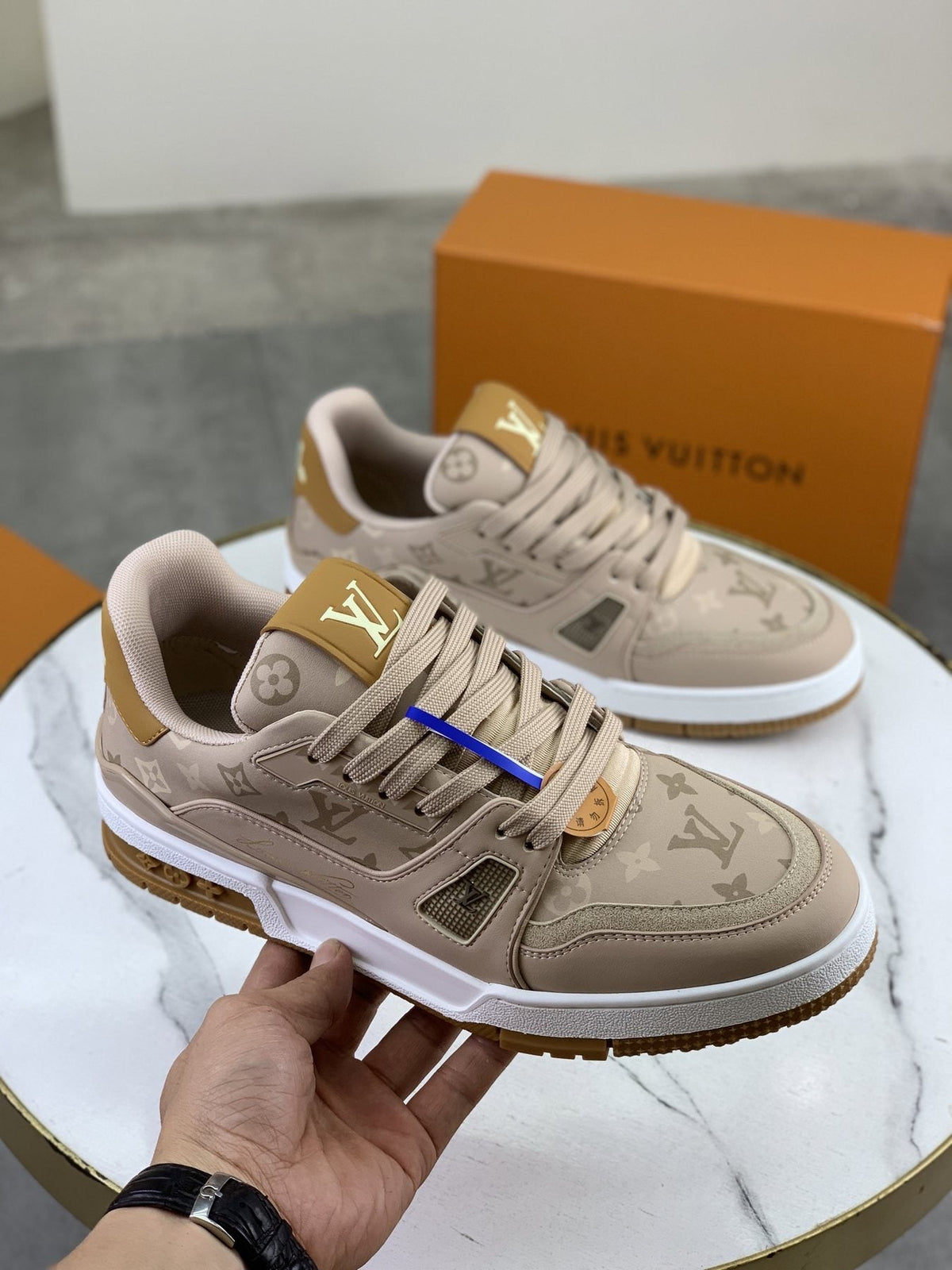 Louis Vuitton Beige, White & Gold Low-Top Sneakers — model