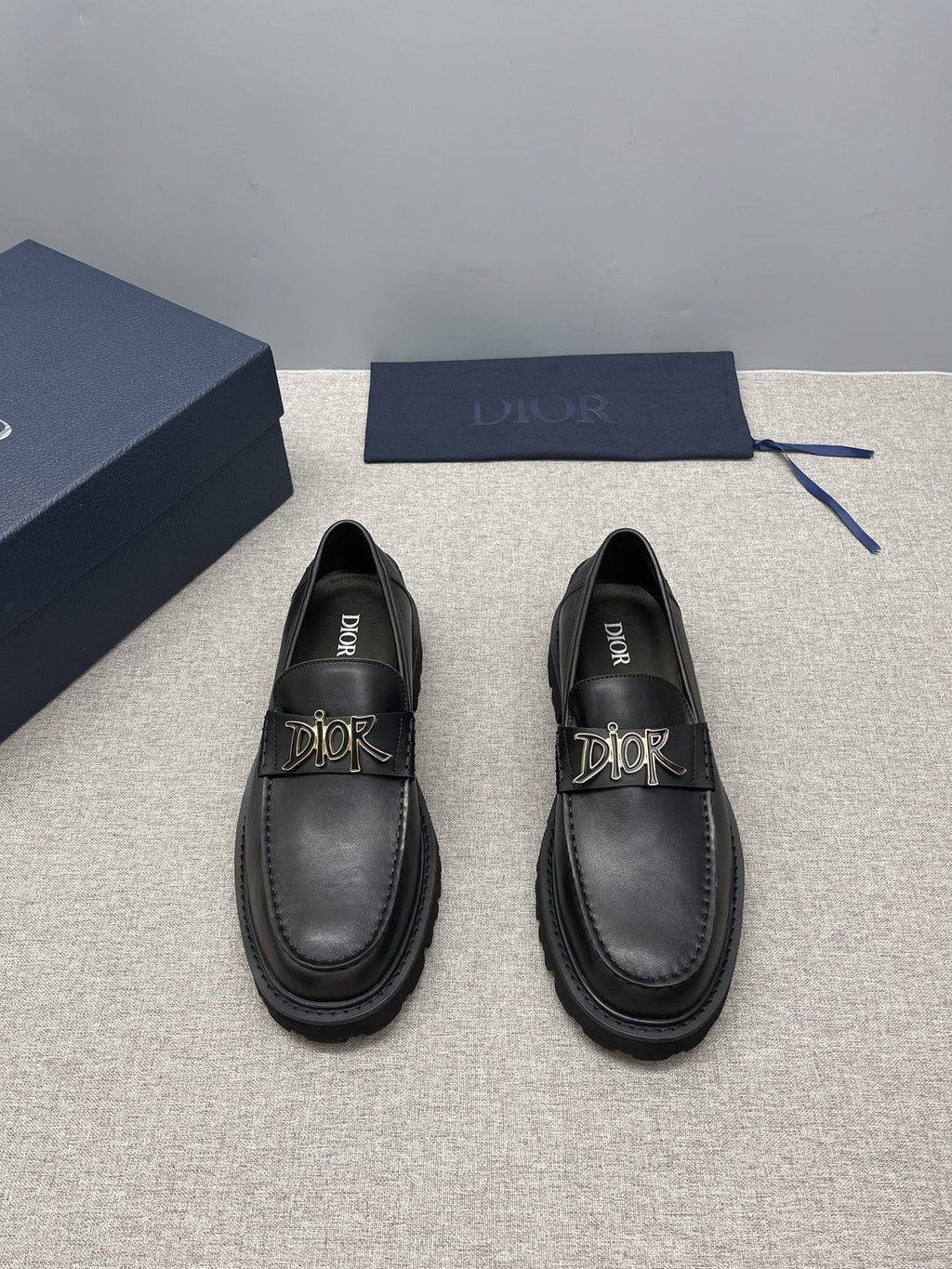 Dior Black Gold-Plaque Slip-On Shoes — front